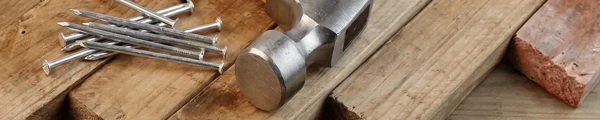 Hammer and nails on hardwood flooring boards in Cape Coral, FL