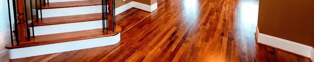 Base floor of a staircase with professionally restored wood flooring in Cape Coral FL