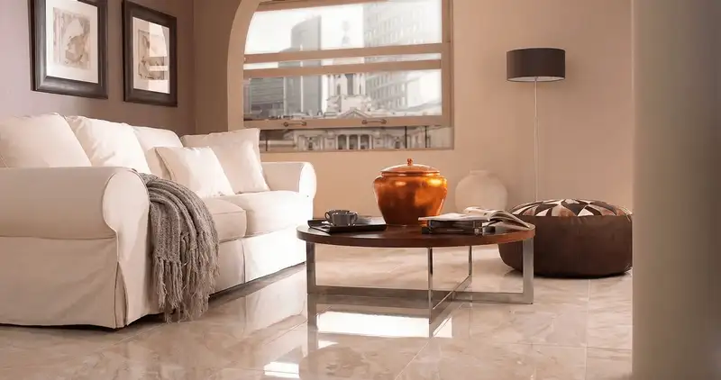 Modern living room with professionally installed marble flooring, a beige sofa, coffee table in Cape Coral, FL