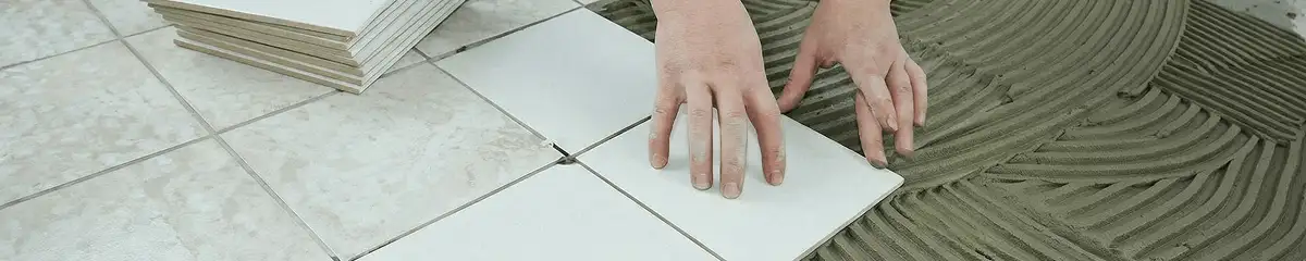 Professional installing white tile floors in Cape Coral, FL
