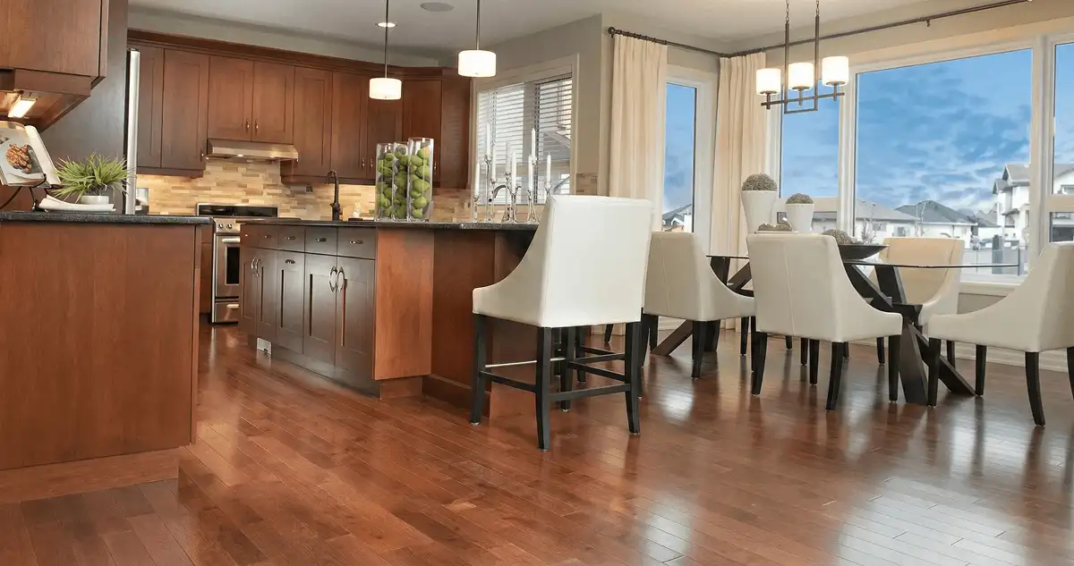 A modern kitchen with professionally installed wood flooring in Cape Coral, FL